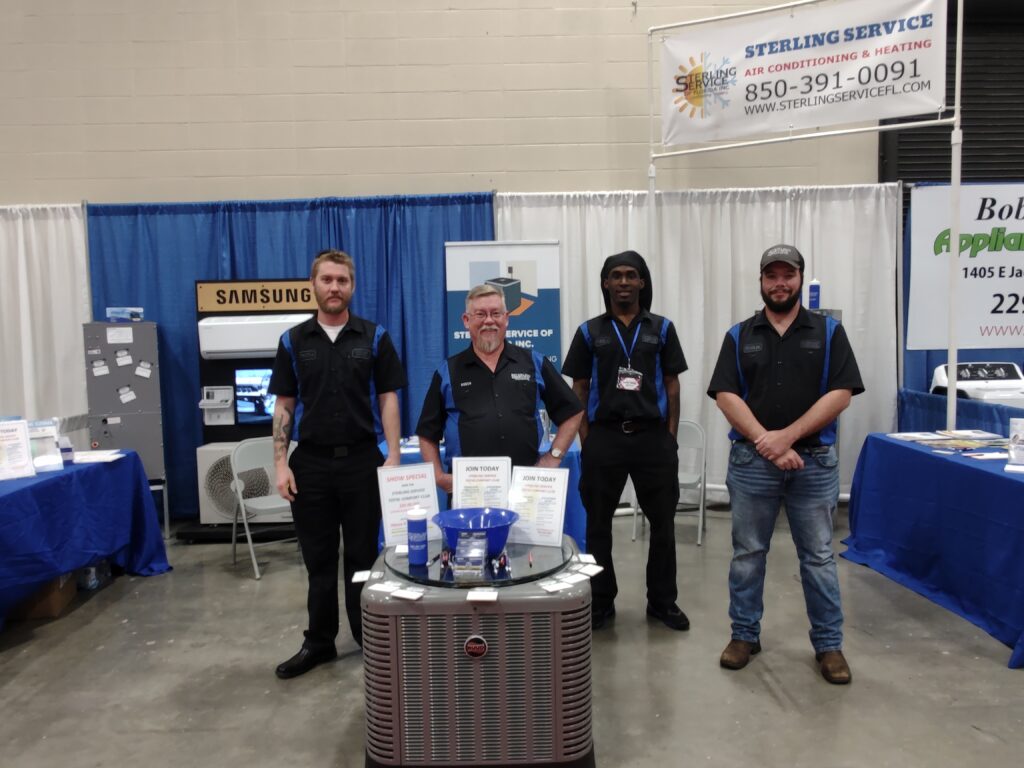 Sterling Service of Florida team at their booth during a home show.